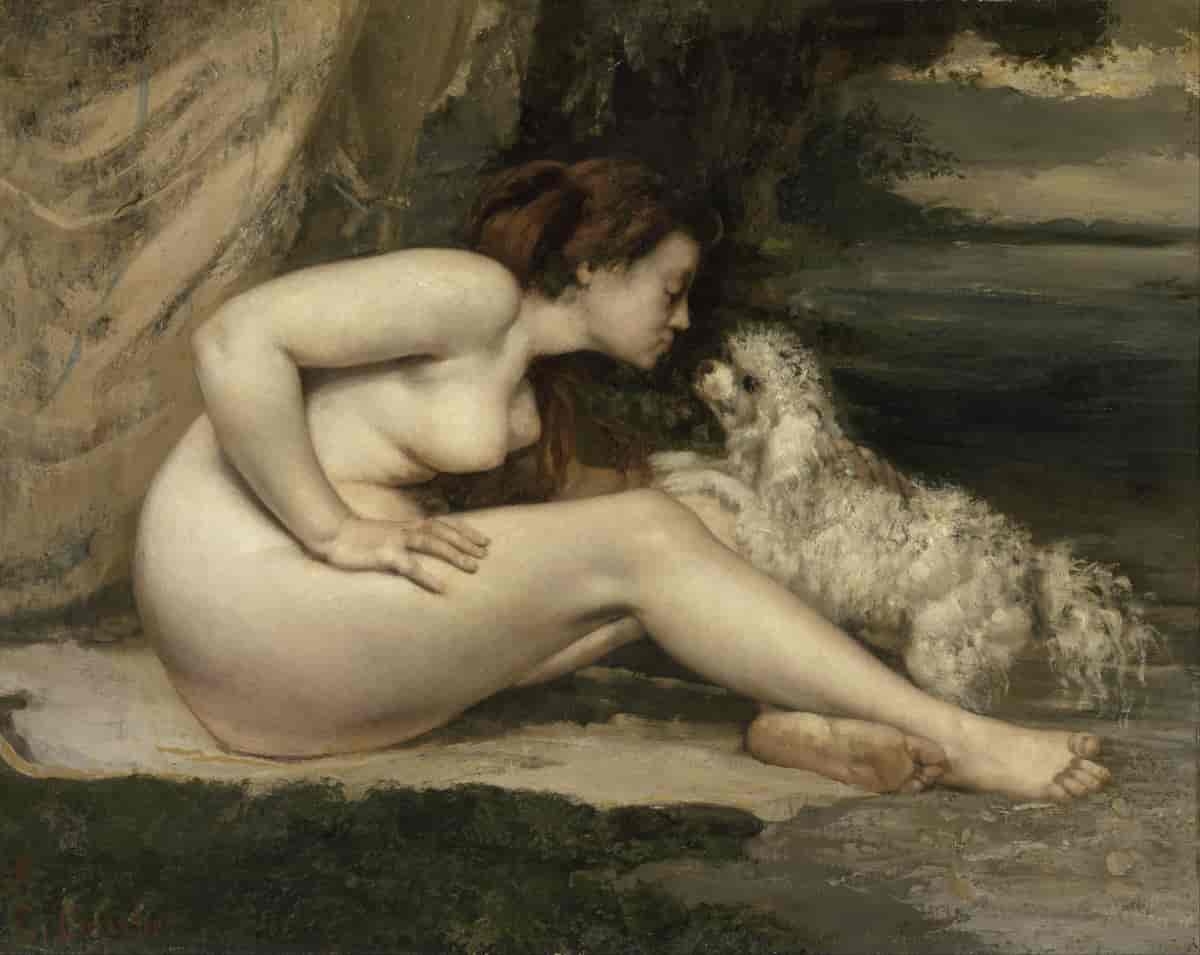 Naken kvinne med hund