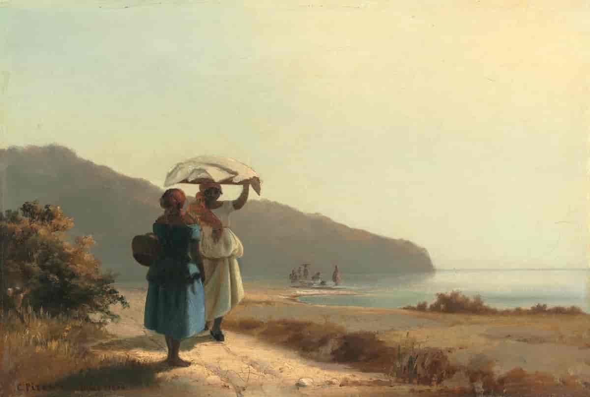 To kvinner som prater ved havet