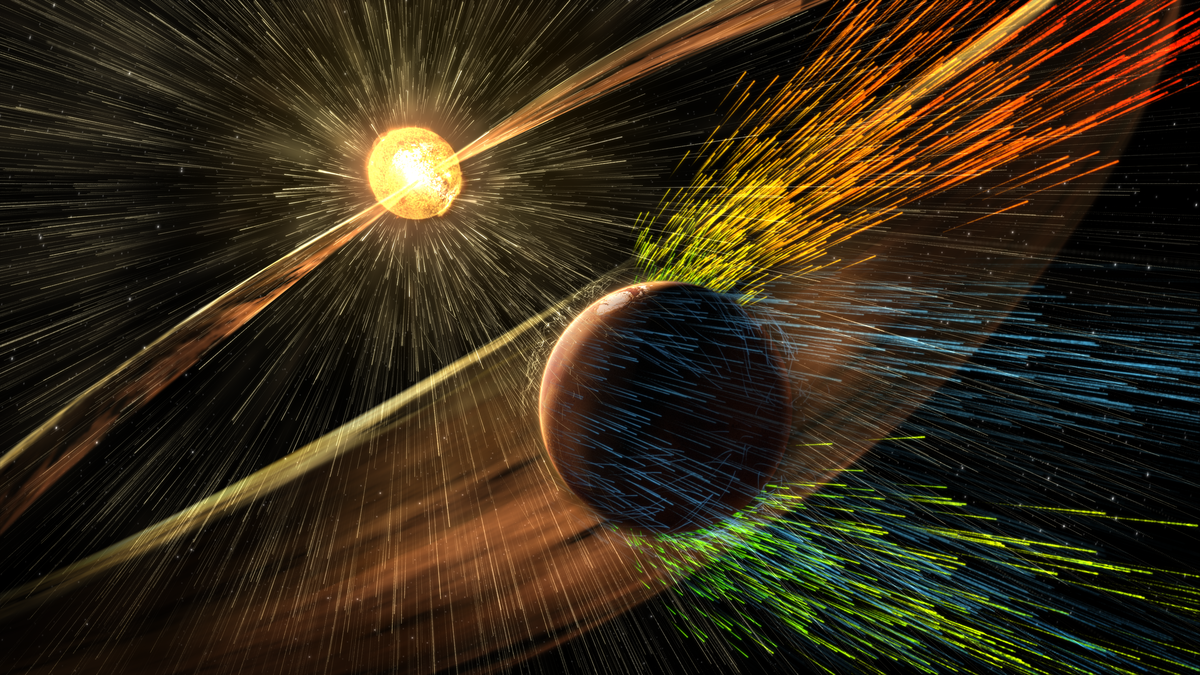 Tegningen viser to planeter. Den som er lengst vekk er gul og skinnende, med lysstråler ut fra seg. I forgrunnen er Mars, og den har også stråler ut fra seg i gule, oransje, grønne og blå farger. Strålene går mot høyre, bort fra sola i bakgrunnen.