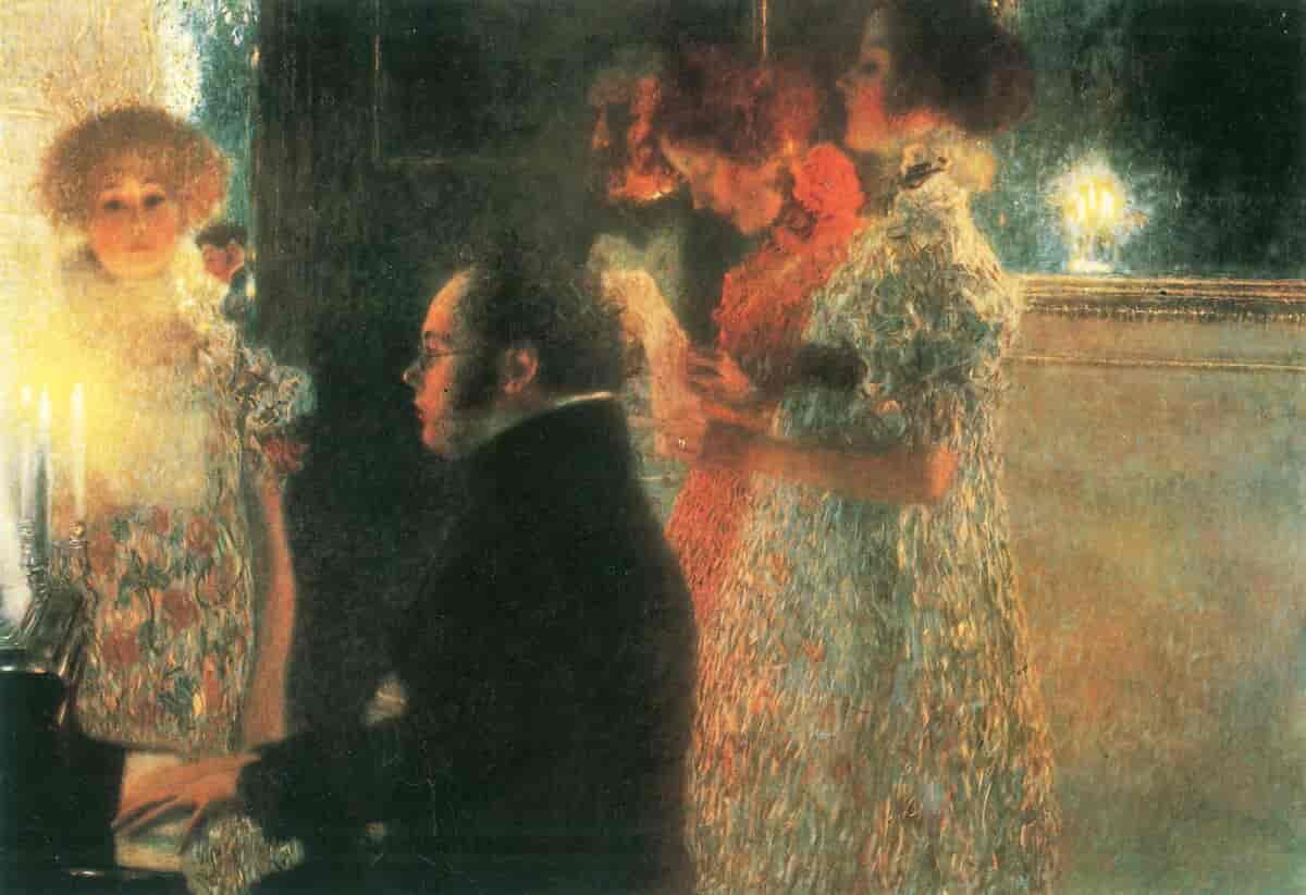 Schubert sitter ved piano og spiller. Noen kvinner står rundt ham og synger.