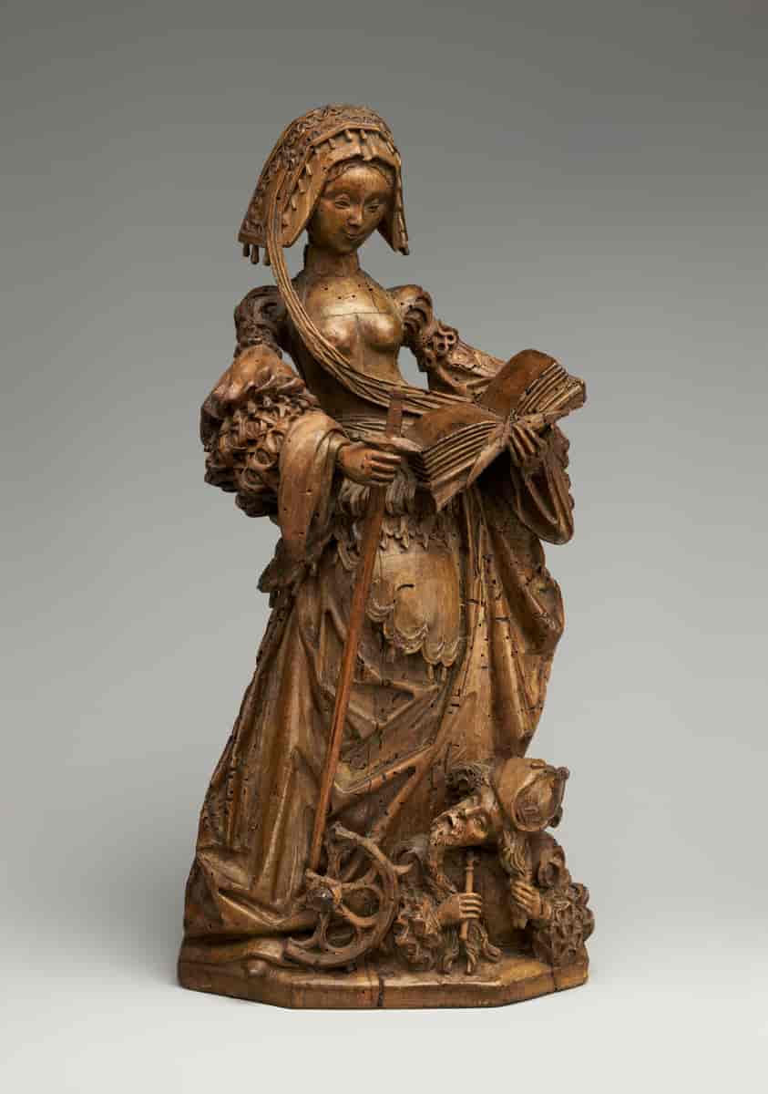 Tysk skulptur fra ca. 1530 som viser Katarina med hennes typiske attributter hjul, sverd og bok. Hun har underlagt seg keiser Maxentius.