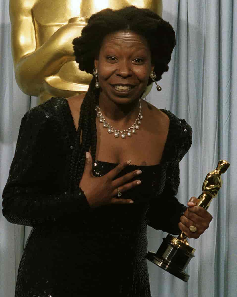Whoopi Goldberg holds her Oscar