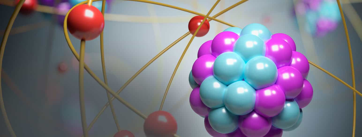 Fotografi av en fargerik plastmodell av et atom